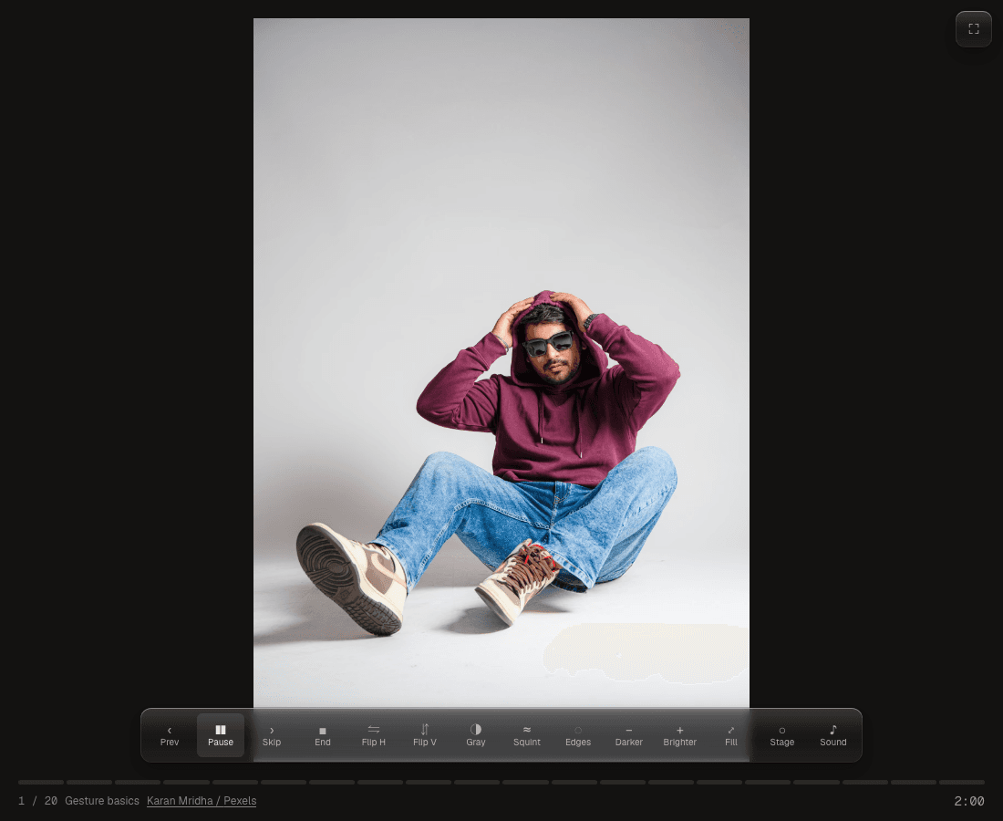 A timed drawing session with a pose photograph, a timer at the bottom right, and playback and study controls below the image.